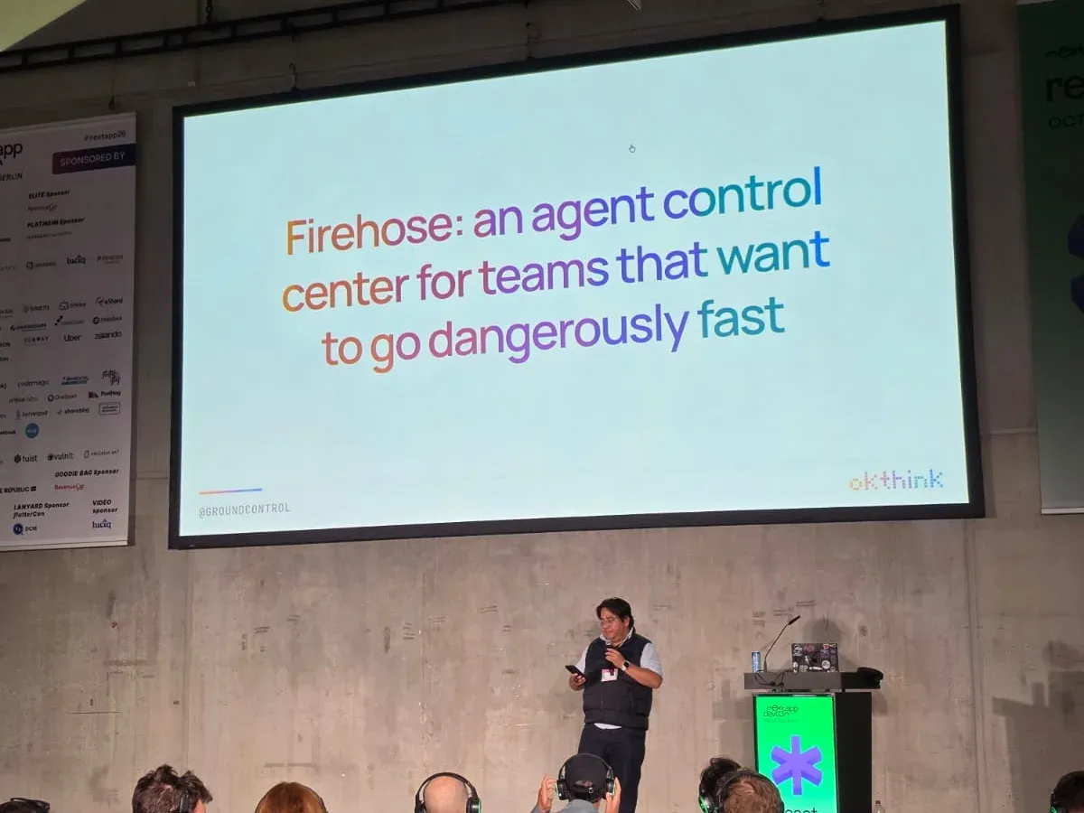 Rafael presenting on the devCon stage in front of a slide reading Firehose: an agent control center for teams that want to go dangerously fast